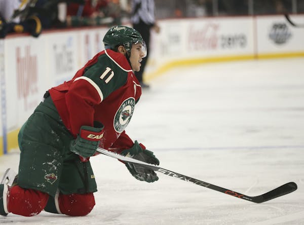 Wild left wing Zach Parise struggled to get to his feet after a hit into the boards in the first period of Thursday's game.