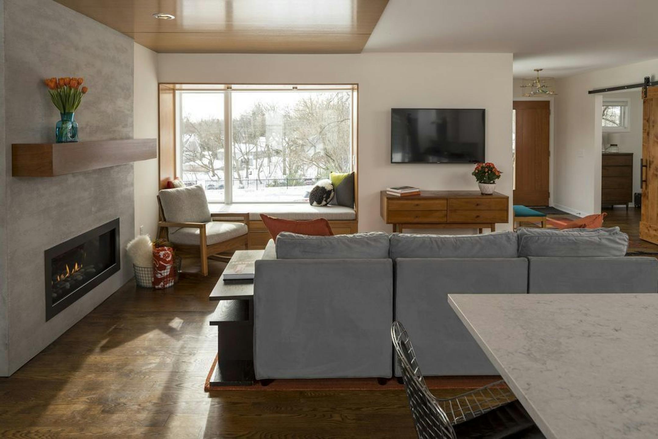 The open main floor has a Douglas fir trimmed bumpout bay window and streamlined gas fireplace.