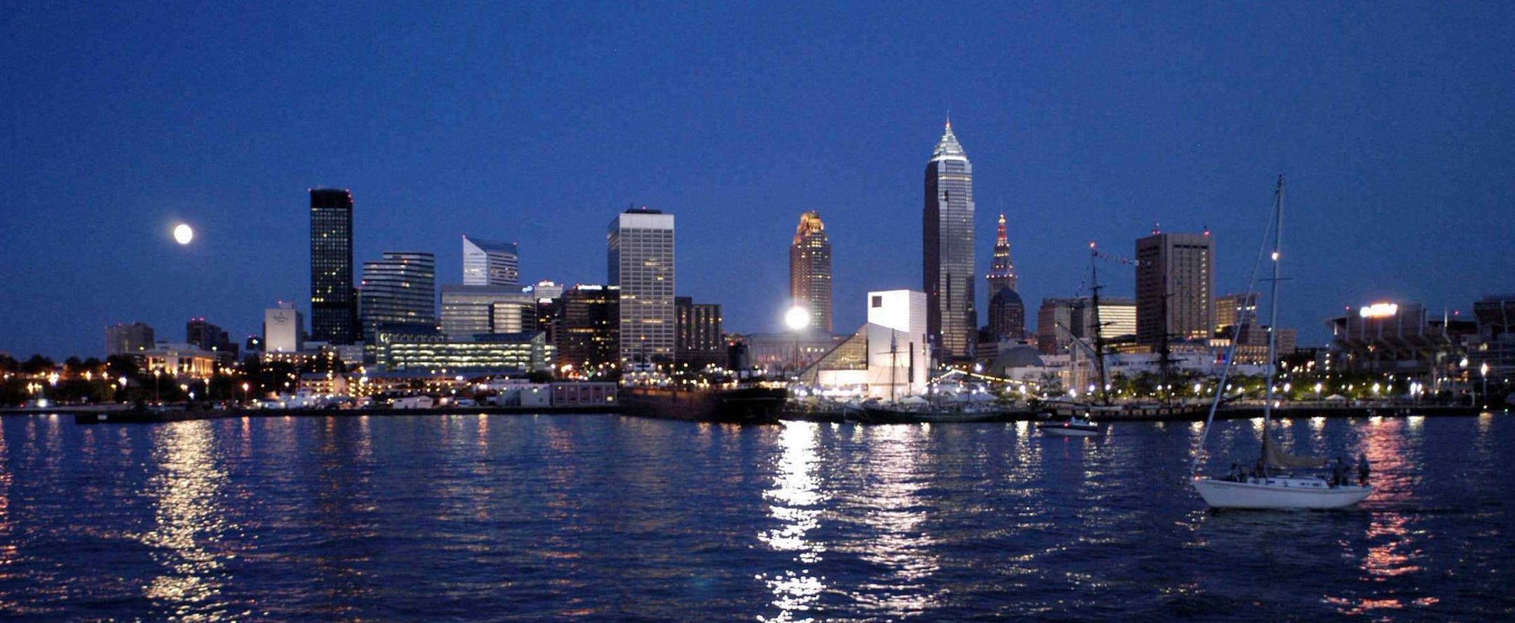 Cleveland Skyline From Lake Erie Cleveland's beautiful skyline at night features Key Tower, the tallest building between New York City and Chicago; the BP Building; and the Terminal Tower, the second tallest building in the world when it opened in 1930 at 52 stories high. The white facade of the Rock and Roll Hall of Fame and Museum shines brilliantly into the night. Download Hi Resolution Image © Courtesy of Convention & Visitors Bureau of Greater Cleveland ORG XMIT: MIN2014062815545648