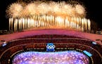 Fireworks light up the sky over Olympic Stadium during the closing ceremony of the 2022 Winter Olympics, Sunday, Feb. 20, 2022, in Beijing. (AP Photo/