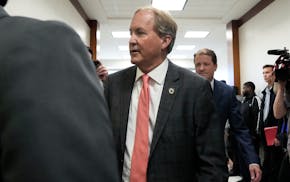 Texas Attorney General Ken Paxton appears at a pretrial hearing in his securities fraud case before state District Judge Andrea Beall, Tuesday, March