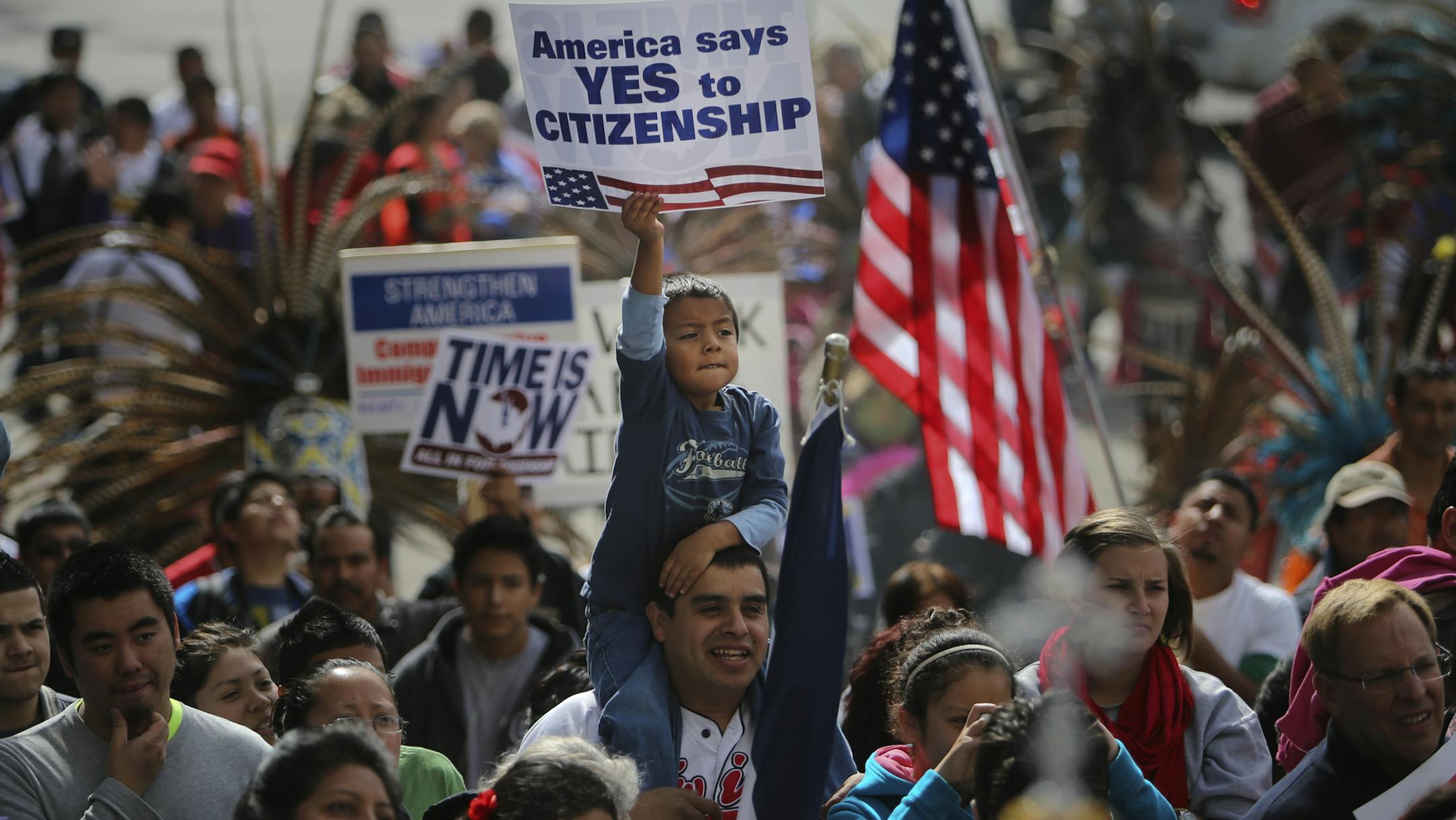 A father and son were among the thousands rallying outside the Basilica of St. Mary before the group marched on to the Hennepin County Government Center Plaza Saturday, Oct. 5, 2013, in Minneapolis, MN.](DAVID JOLES/STARTRIBUNE) djoles@startribune.com Thousands of immigration reformers from Minnesota&#x201a;&#xc4;&#xf4;s business, faith, labor, education, and immigrant communities staged a massive rally and march Saturday, Oct. 5, 2013, to urge the House of Representatives to pass immigration re