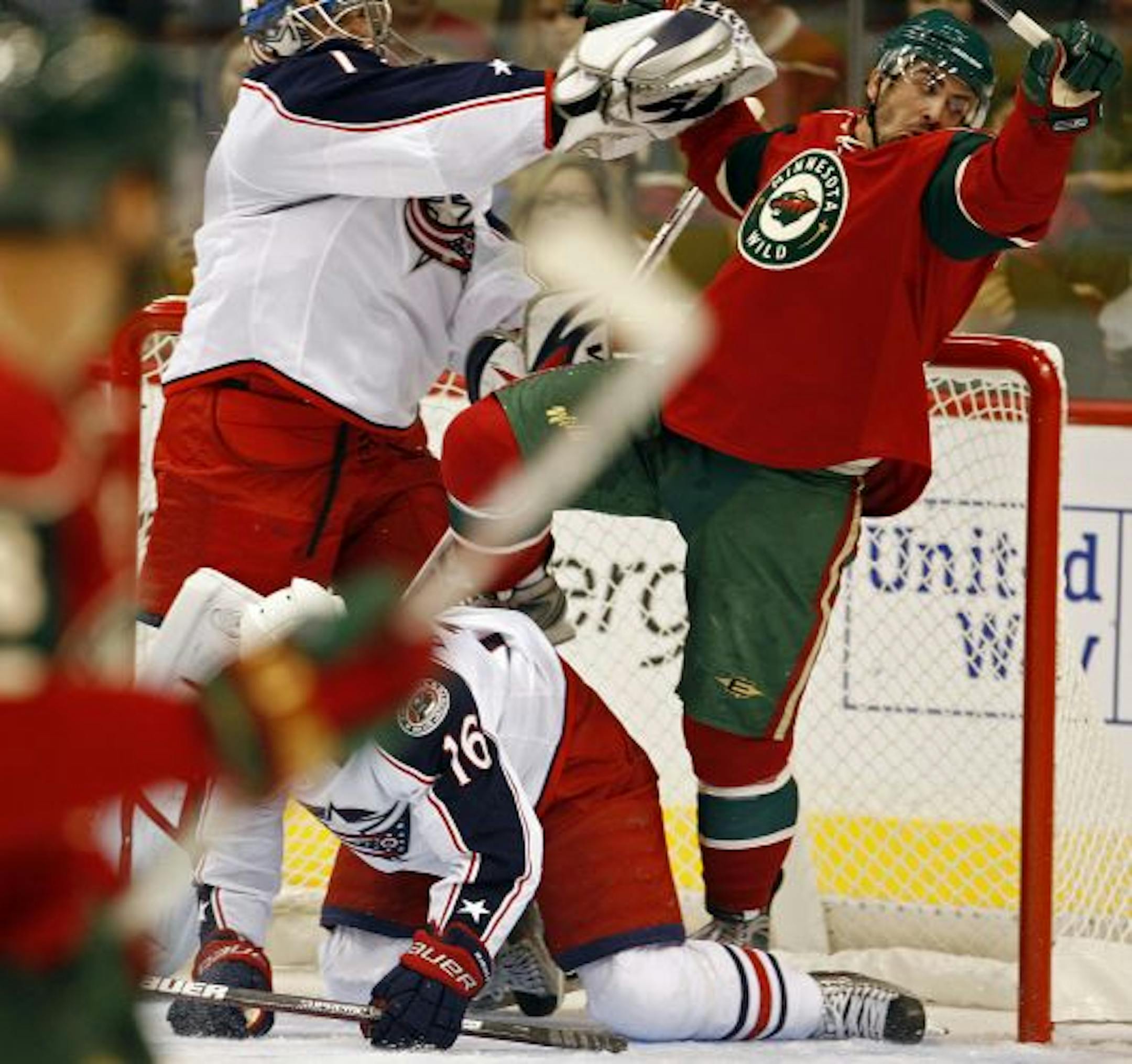 The Wild's Cal Clutterbuck, right, and Columbus goalie Steve Mason mixed it up near the net in a preseason game earlier this week.