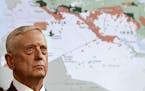 Secretary of Defense Jim Mattis stands in front of a map of Syria and Iraq, while speaking to the media about the Islamic State group, Friday, May 19,