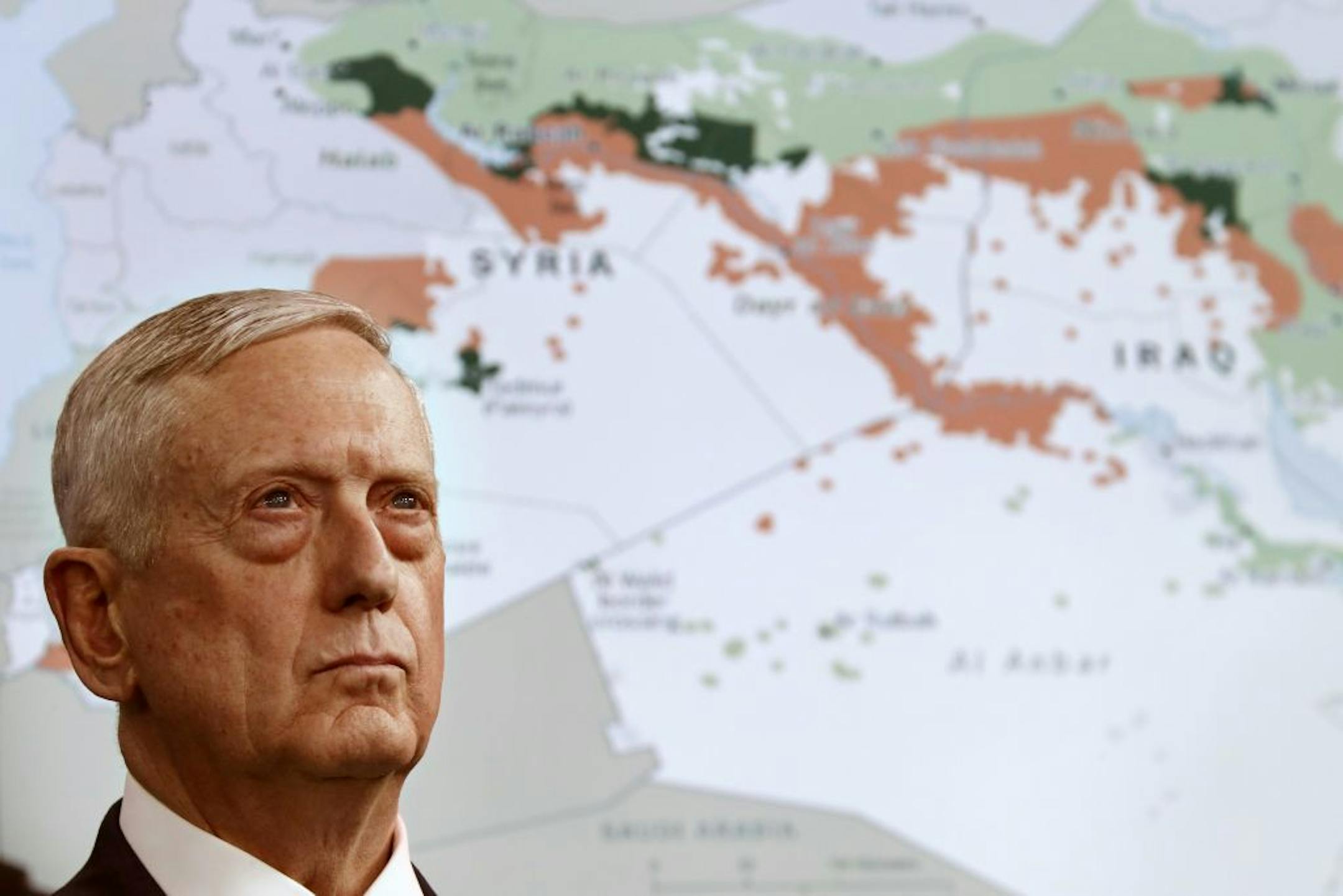 Secretary of Defense Jim Mattis stands in front of a map of Syria and Iraq, while speaking to the media about the Islamic State group, Friday, May 19, 2017, at the Pentagon.