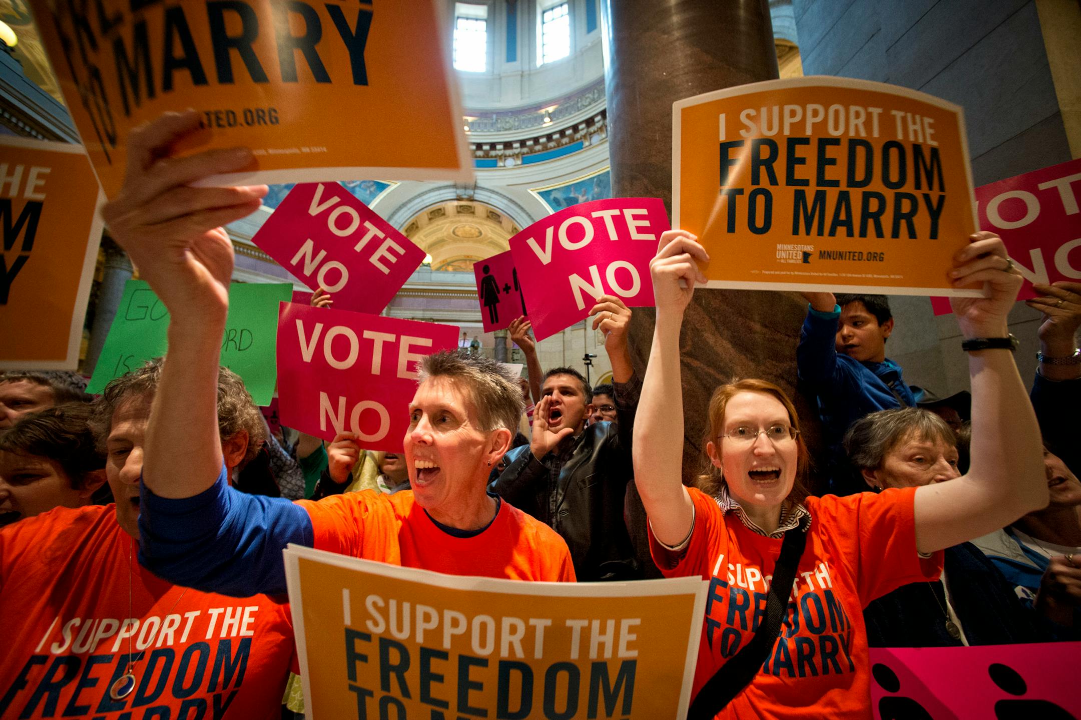 In this file photo, advocates for both sides chant, sing and plead as they lined the entrance to the House floor at the state Capitol in St. Paul on Thursday, May 9, 2013.