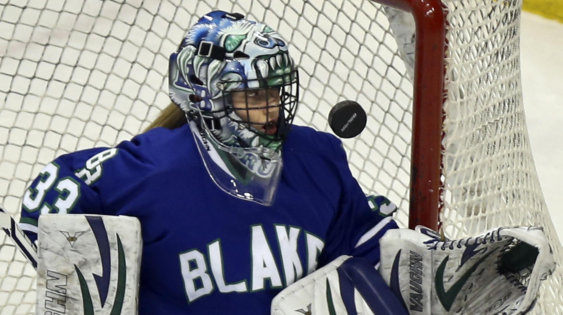 Blake School goalie Anna Kreusel, an eigth grader, made a save on a shot against East Grand Forks High during the firt period of Blake's 3-2 come-from-behind victory over East Grand Forks High Saturday, March 22, 2014, at the Xcel Energy Center In St. Paul, MN.](DAVID JOLES/STARTRIBUNE) djoles@startribune.com Girls' hockey, Class 1A championship game Saturday, March 22, 2014, at the Xcel Energy Center In St. Paul, MN.**Anna Kreusel,cq