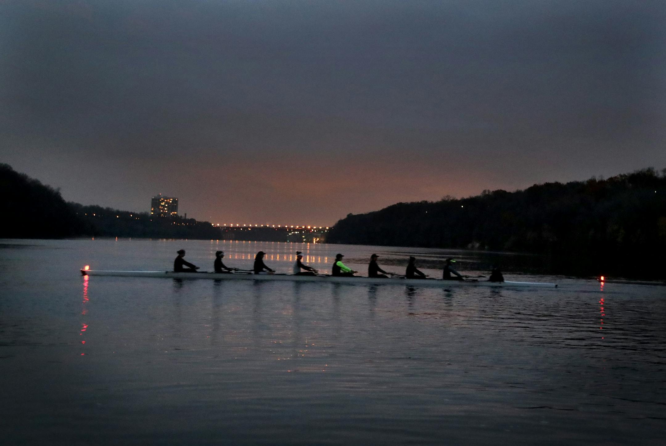 Members of the University of Minnesota rowing team get into position on the river for their morning work out Thursday, Oct. 27, 2016, on the Mississippi River in Minneapolis, MN.](DAVID JOLES/STARTRIBUNE)djoles@startribune.com "The Boys in the Boat'' book, about the mystical powers of competitive rowing. The Gophers rowing team will be in his column, and we'd like photos of the team working out and practicing and the scene around rowing