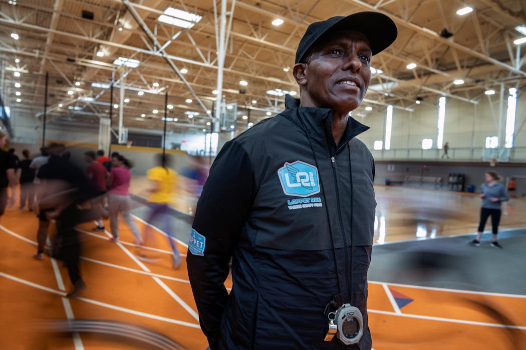 Abdi Bile, shown here in this 2020 file photo, directs Loppet Run 365, guiding young people, especially Somali American youth, on the track and in helping them follow their dreams.
