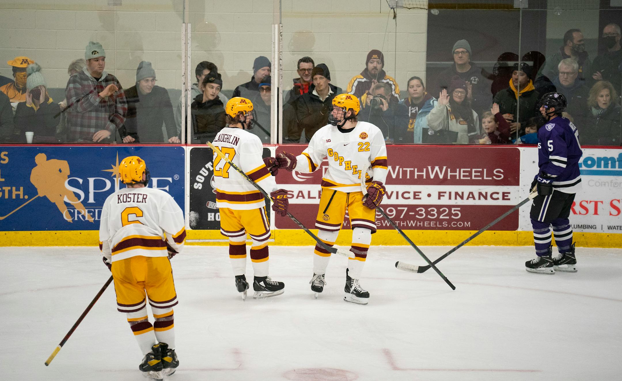 Gophers forward Blake McLaughlin (27) congratulated Gophers forward Bryce Brodzinski (22) after his first period goal Sunday afternoon, Jan. 2, 2022 at Doug Woog Arena in South St. Paul.