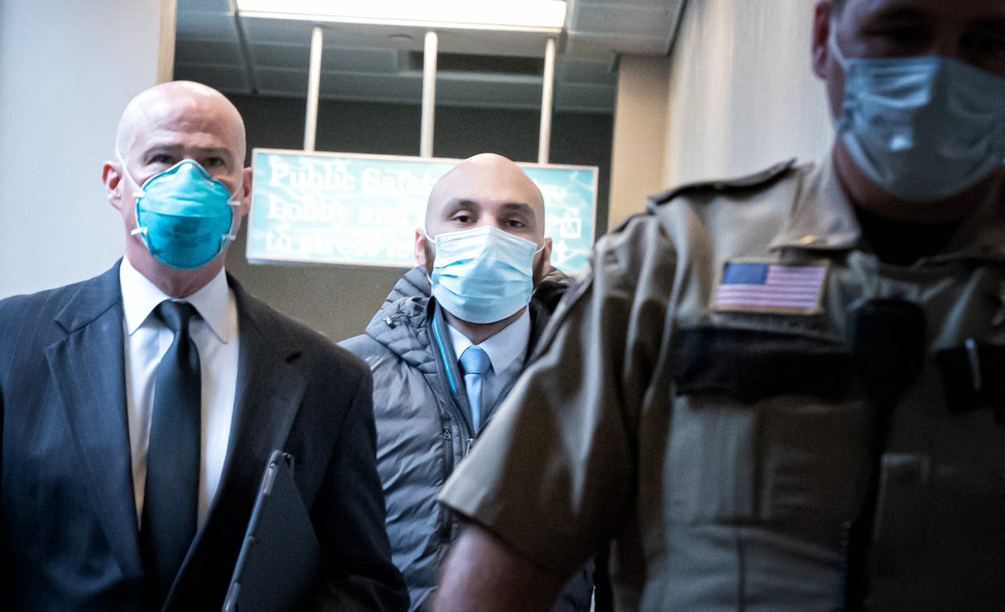 Former Minneapolis police officer J. Alexander Kueng, center, walked out of the Hennepin County Public Safety Facility Monday afternoon with his attorney Thomas Plunkett. ] GLEN STUBBE • glen.stubbe@startribune.com Monday, June 29, 2020 All four former officers charged in the killing of George Floyd will appear in court one-at-a-time Monday starting at 12:15 p.m. Derek Chauvin will appear remotely via remote TV. Two of his former colleagues, J. Alexander Kueng and Thomas Lane, have posted bond s