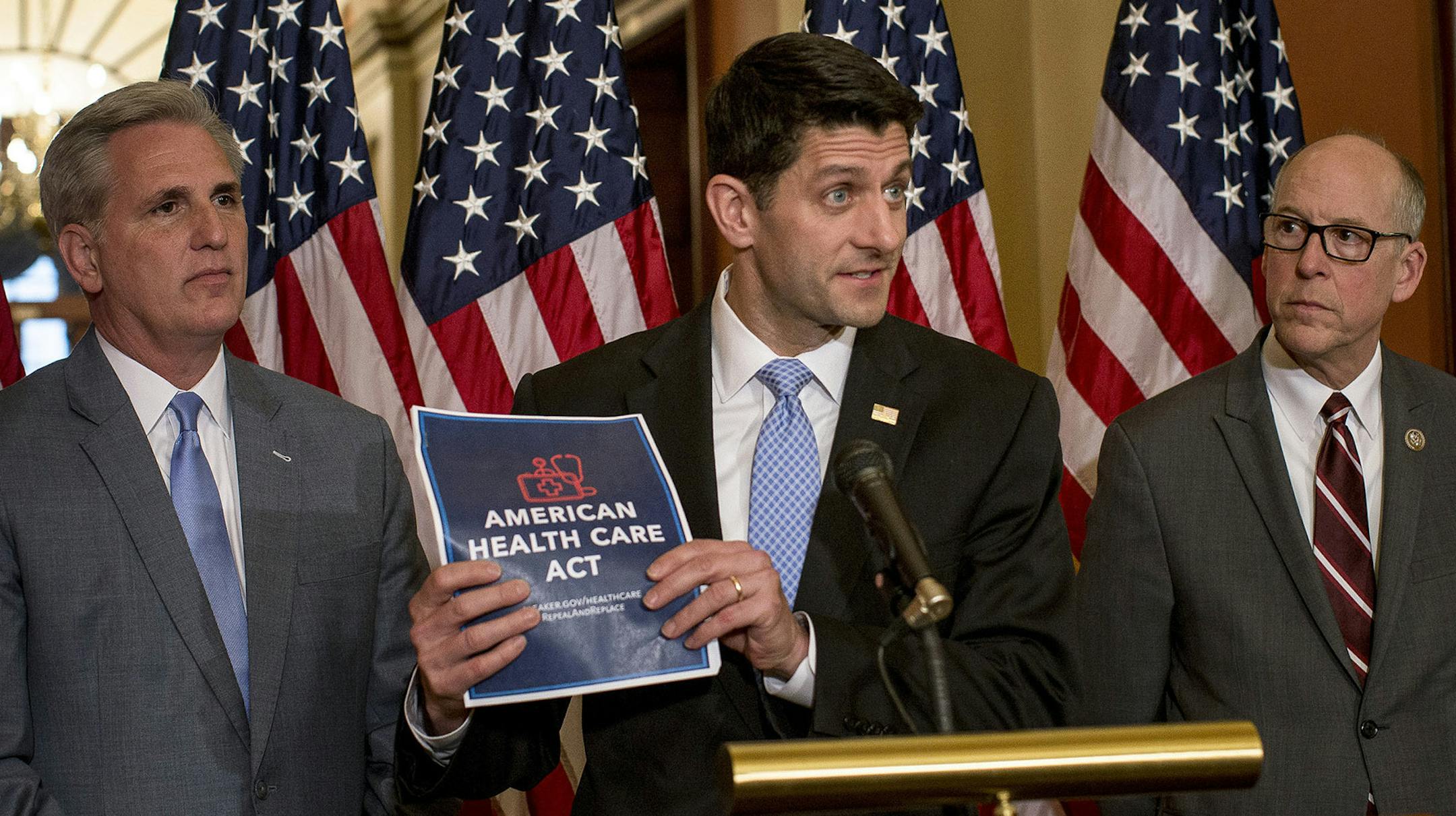 FILE -- House Speaker Paul Ryan, center, speaks at a news conference regarding the American Health Care Act, on Capitol Hill in Washington, March 7, 2017. The House Republican plan to repeal and replace the Affordable Care Act would cause 24 million people to lose health insurance within a decade, the nonpartisan Congressional Budget Office said on March 13. From left: Rep Kevin McCarthy (R-Calif.), Ryan and Rep. Greg Walden (R-Ore.). (Gabriella Demczuk/The New York Times) ORG XMIT: MIN201703221
