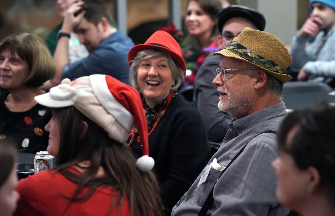 During a Christmas murder mystery party, Diane and Mark Konecny enjoyed the festivities with their younger neighbors at Mill and Main.