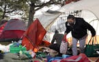 Mara, who wished not to have her last name used, a neighbor to a homeless encampment near downtown, helped cleared out the remaining tents and their c