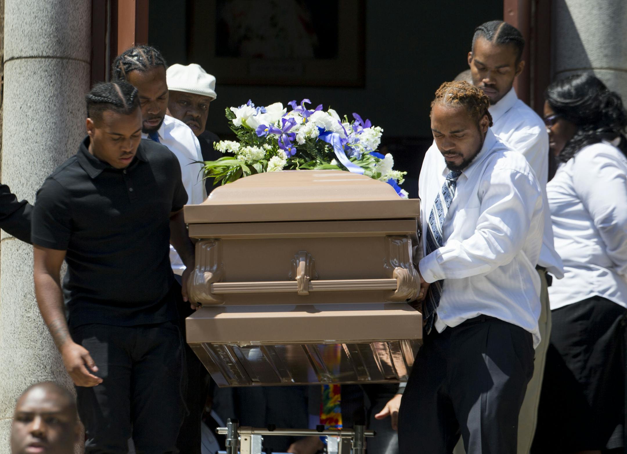 Pallbearers carried the casket holding Blevins down the steps of the church and to the hearse. ] ALEX KORMANN • alex.kormann@startribune.com The funeral for Thurman Blevins, 31, a black man shot and killed by Minneapolis Police on June 23rd, was held at Faith Deliverance Holiness Church on Saturday, July 14, 2018. Hundreds of mourners gathered in the church to pray and chant in Blevins' memory. The service was two hours long after which the casket was brought to Crystal Lake Cemetery.