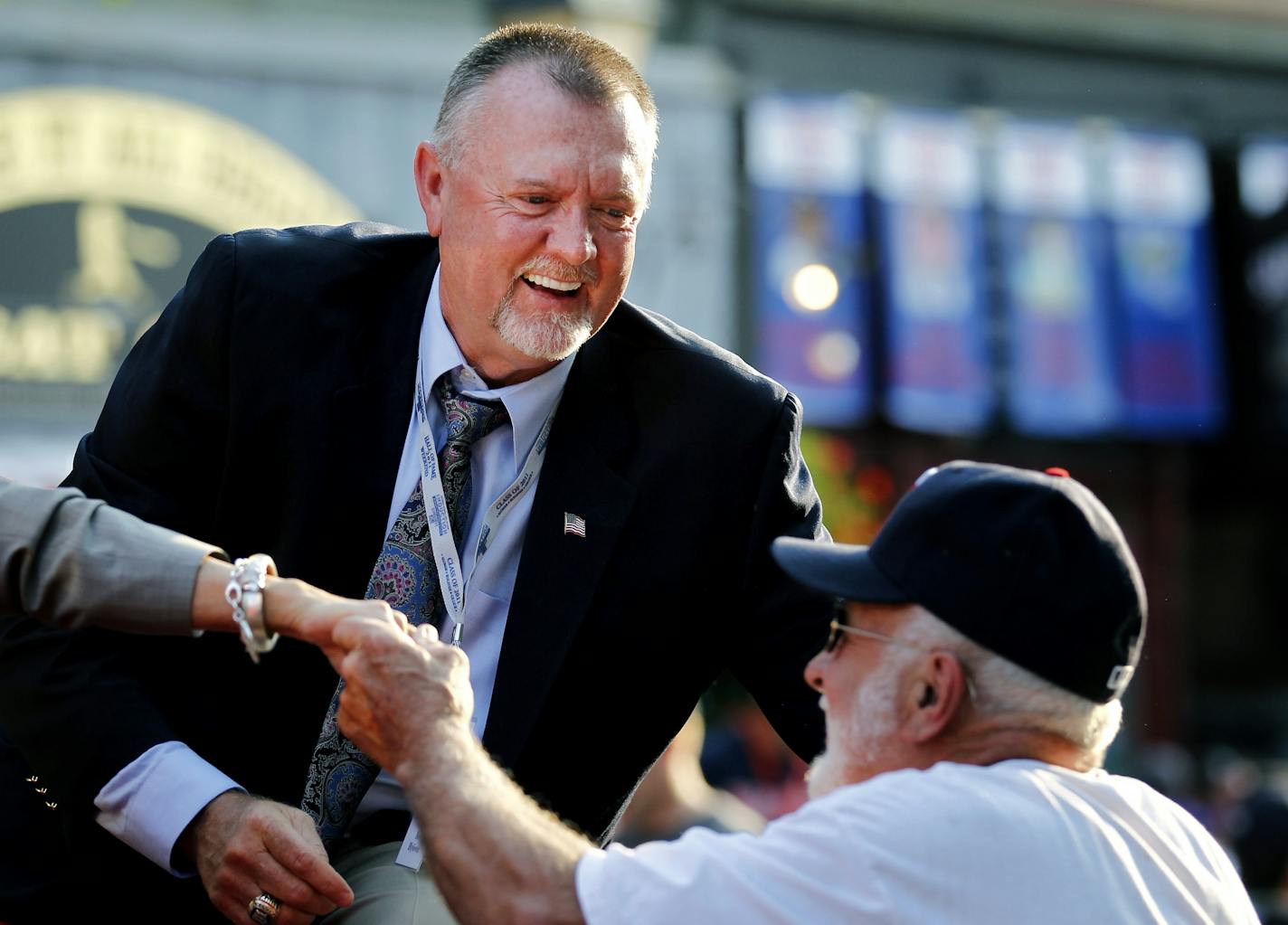 Bert Blyleven shook hands with a fan during the Hall of Fame Legends Parade through downtown Cooperstown, NY on Saturday. Blyleven will be inducted into the National Baseball Hall of Fame on Sunday.