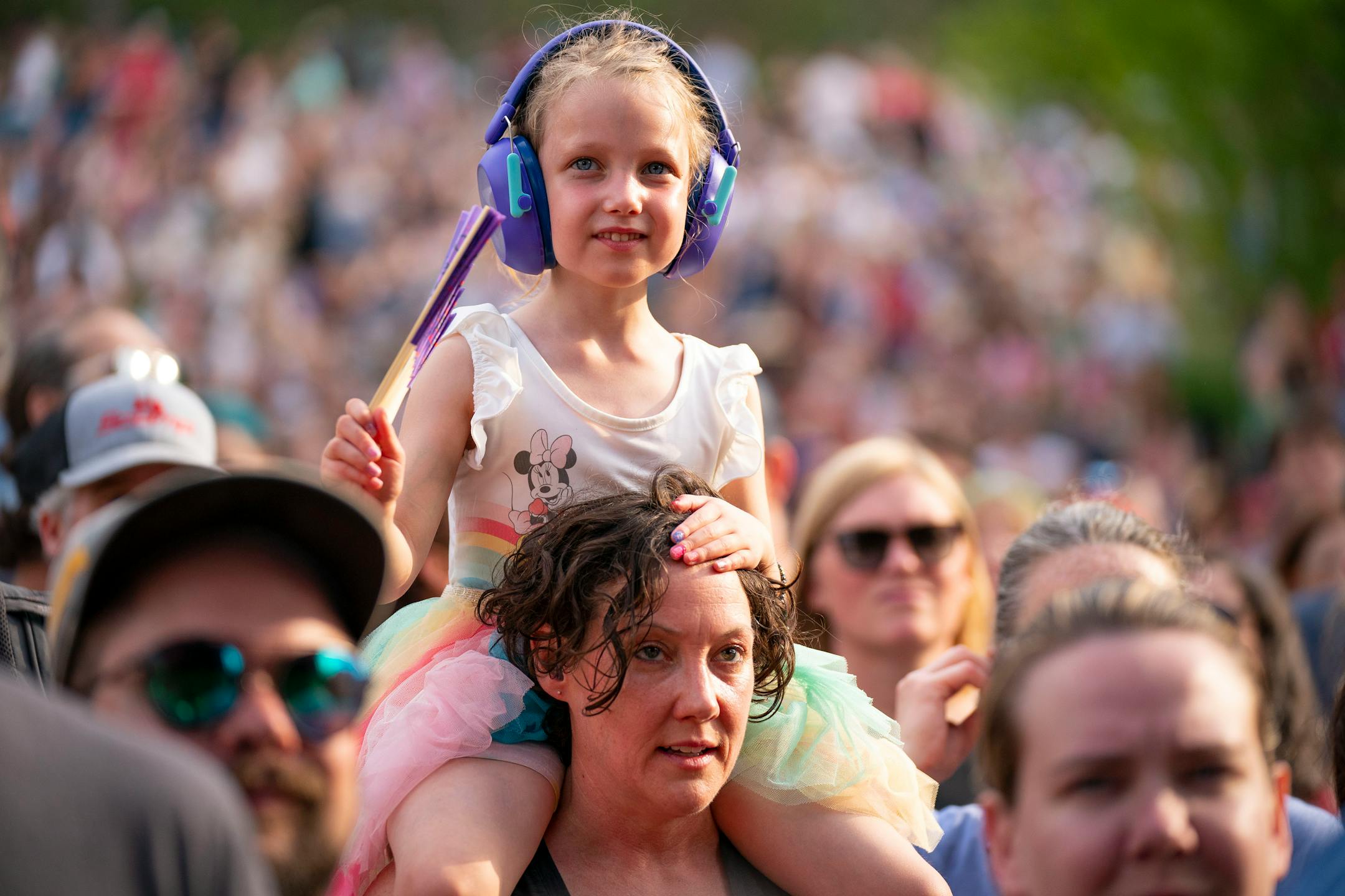 A young fan wears noise reducing headphones while DaM-FunK performs during Rock the Garden.