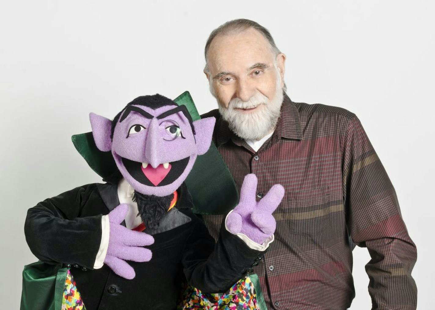 In this June 2012 publicity photo released by "Sesame Street," puppeteer Jerry Nelson is shown with "Sesame Street" character Count von Count in New York. Sesame Workshop announced that Nelson, who suffered from emphysema, died at age 78 on Thursday, Aug. 23, 2012, in his Massachusetts home on Cape Cod.