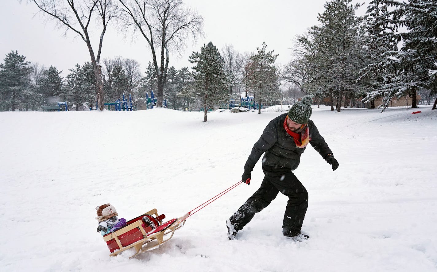 Jared Roddy and his son, Frank, 2, used the sudden snowstorm to go sledding Saturday, Dec. 1, 2018 at Audubon Park in Northeast Minneapolis. The storm dumped between 2 and 4 inches of snow on the Twin Cities with several more inches seen across much of the state. ] ANTHONY SOUFFLE &#xef; anthony.souffle@startribune.com Jared Roddy and his son, Frank, 2, used the sudden snowstorm to go sledding Saturday, Dec. 1, 2018 at Audubon Park in Northeast Minneapolis. The storm dumped between 2 and 4 inche