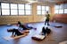 Catherine Squires leads a “Cozy Yoga” class at Reviving Roots, a mental health therapy and wellness center for Black people.