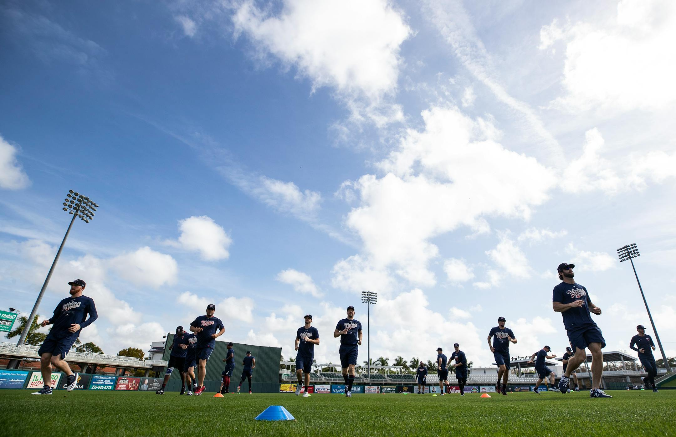 Twins pitchers warmed up on the first day of workouts for pitchers and catchers.