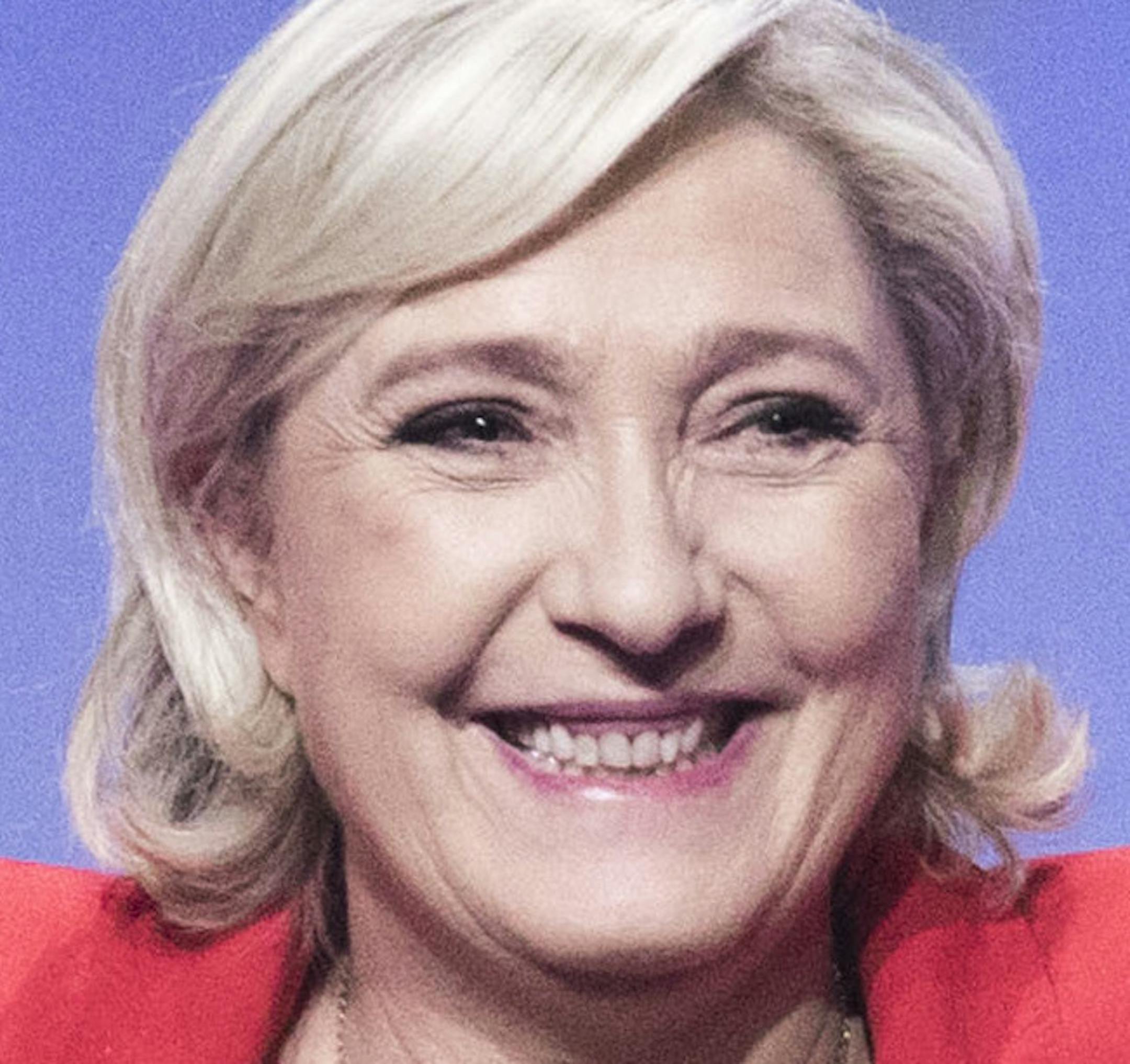 FILE - In this April 17, 2017 file photo, far-right candidate for the presidential election Marine Le Pen gestures as she arrives for a campaign meeting in Paris. Marine Le Pen, whose passion for politics and far-right values were forged in the cradle, is making her second bid for the French presidency, hoping this time to break through the ceiling of fear that stopped her father from winning in 2002. (AP Photo/Kamil Zihnioglu, File)