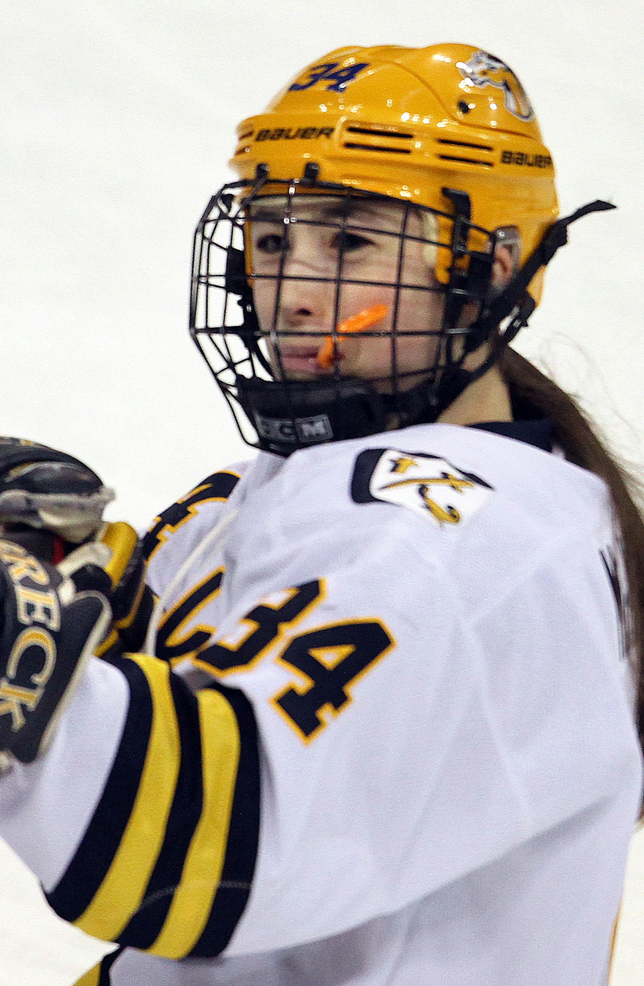 Girls State Hockey Tournament, Class A Semifinals, Breck vs. Red Wing. 2/24/12. (left to right) Breck's Milica McMillen made like a sharp shoot after scoring her 2nd goal in the first period against Red Wing.] Bruce Bisping/Star Tribune bbisping@startribune.com. Milica McMillen/program. ORG XMIT: MIN2012122014492413