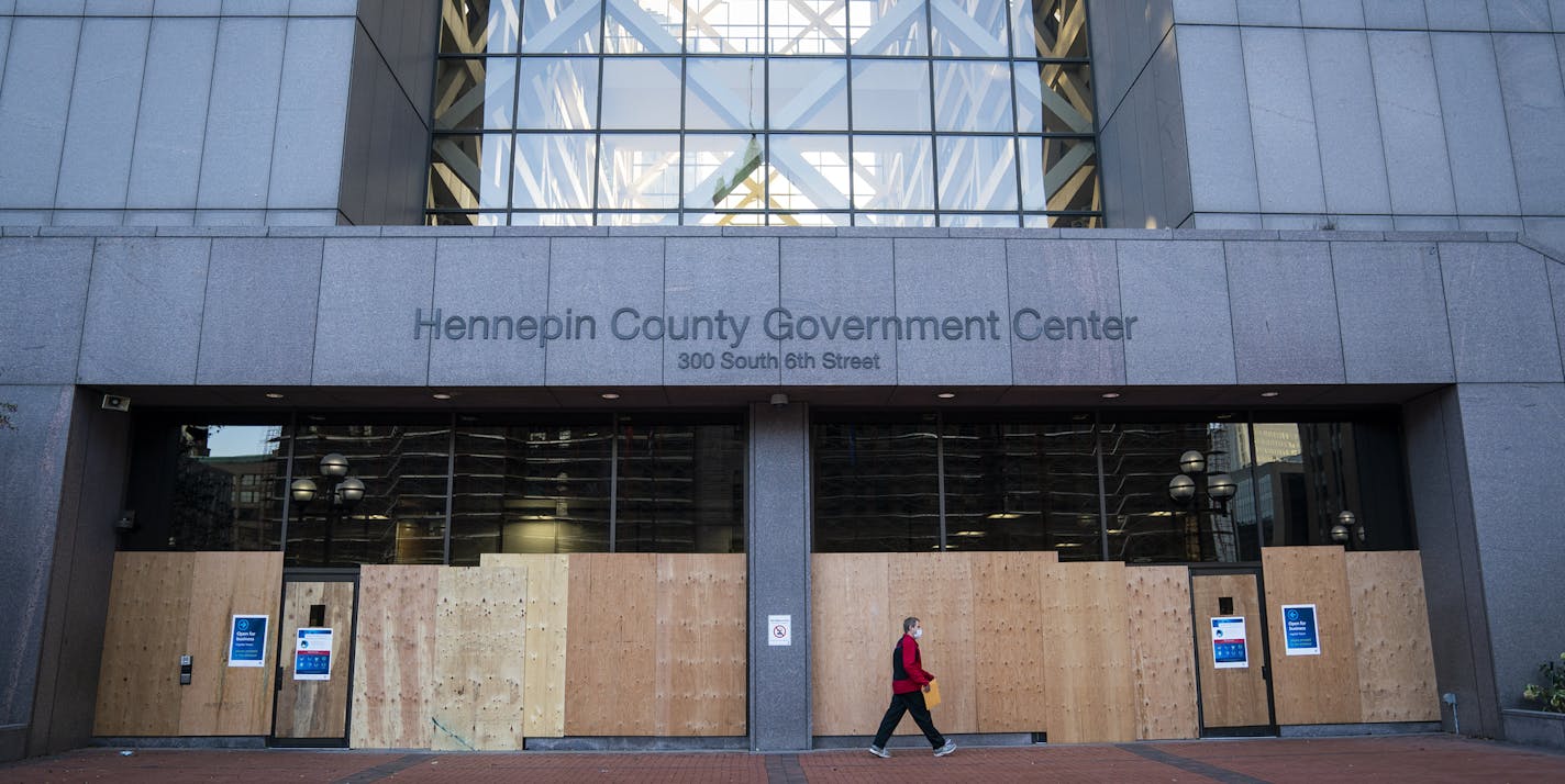 Boarded-up doors and windows outside the Hennepin County Government Center in downtown Minneapolis. Monday, Nov. 2, 2020, amid worries about the potential for demonstrations and violent responses to the general election." (Leila Navidi/Star Tribune via AP)