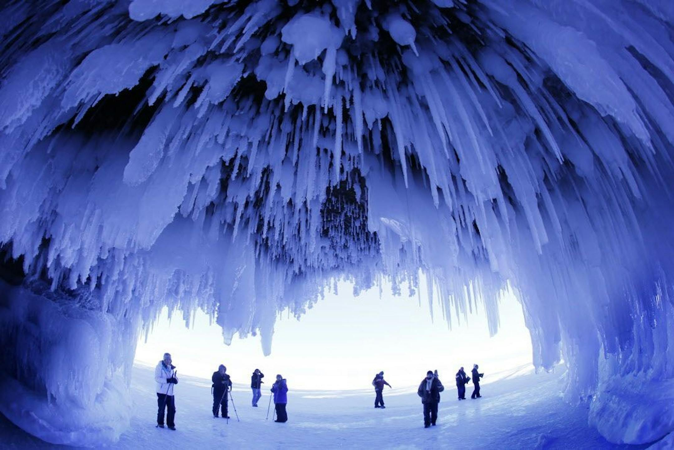 It's been 5 years since the ice has frozen along the south shore of Lake Superior, creating access to the wonders of the Ice Caves of the Apostle Islands National Lakeshore. Over the weekend over 8,000 people made the pilgrimage, a mile walk along the frozen shore, to witness and photograph the crystal wonders of the caves.