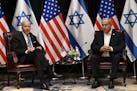 President Joe Biden, left, listens to Israel's Prime Minister Benjamin Netanyahu as he joins a meeting of the Israeli war cabinet  in Tel Aviv on Oct.
