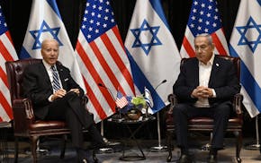 President Joe Biden, left, listens to Israel's Prime Minister Benjamin Netanyahu as he joins a meeting of the Israeli war cabinet in Tel Aviv on Oct.