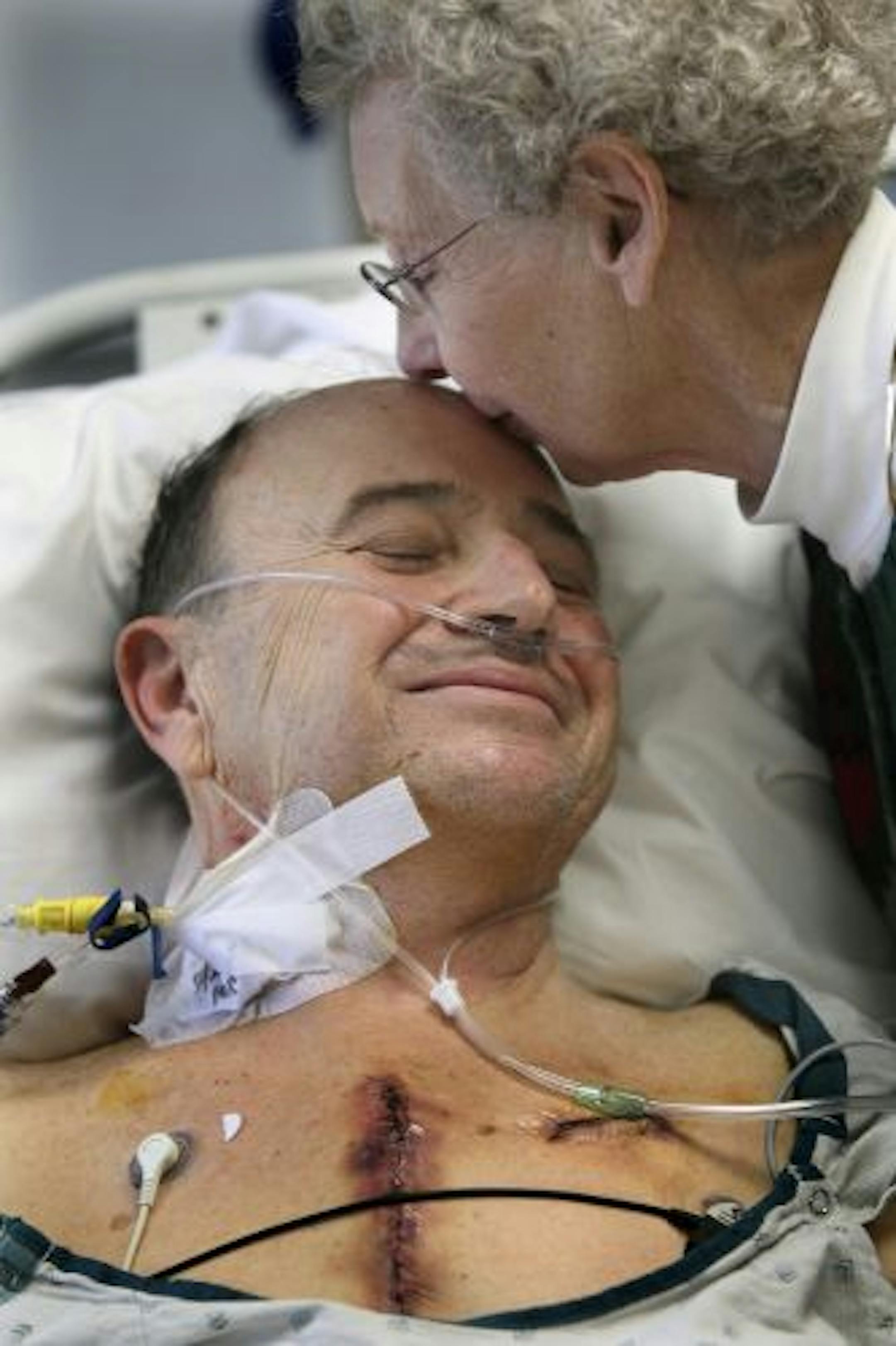 Carolyn Weber gave her husband Don a kiss in the ICU at Fairview University Hospital. "I have heart #724," said Weber from his bed.