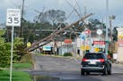 Traffic diverts around downed power lines Monday, Aug. 30, 2021, in Metairie, La. A fearsome Hurricane Ida has left scores of coastal Louisiana reside