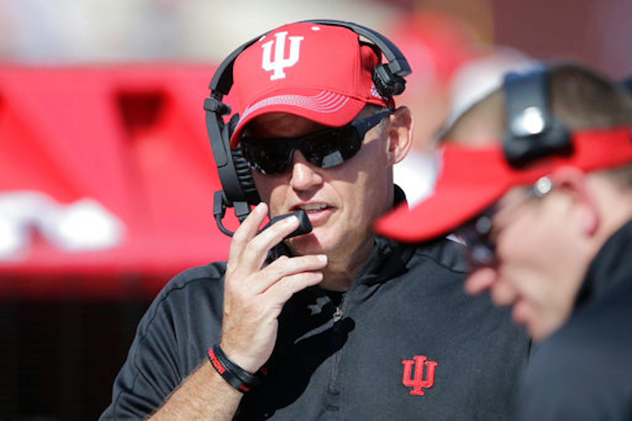 Indiana head coach Tom Allen talks on his headset during the second half of an NCAA college football game against Michigan in Bloomington, Ind., Saturday, Oct. 14, 2017. Michigan won 27-20 in overtime. (AP Photo/AJ Mast)