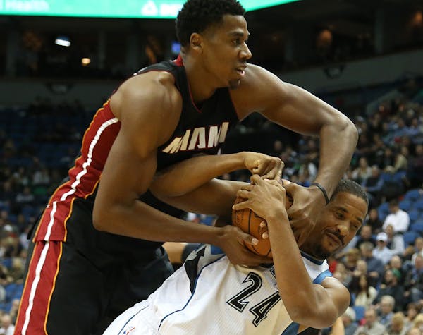 Miami's Hassan Whiteside fouled Wolves Andre Miller going for the ball during the second half at the Target Center in Minneapolis Min., Thursday Novem