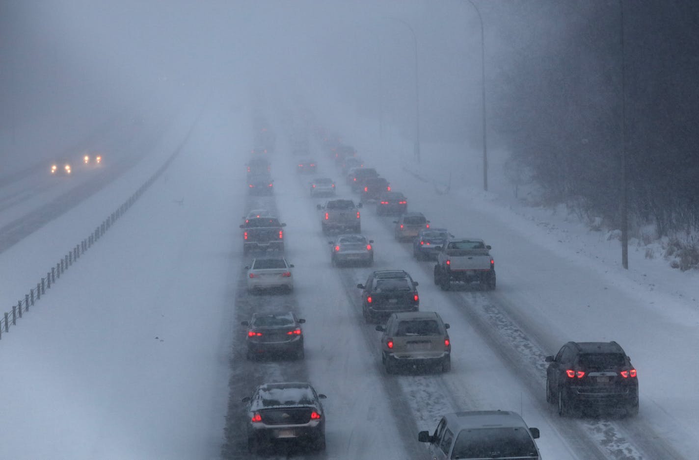 Last month's cold and snow brought out a halt to some construction work around the state, contributing to a decline of about 8,800 jobs in the Minnesota and a second consecutive monthly increase in the state unemployment rate. File photo of cars moving slowly near Coon Rapids during a commute one morning last month.