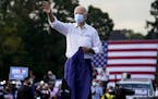 Democratic presidential candidate former Vice President Joe Biden greets supporters during a drive-in rally at Cellairis Amphitheatre in Atlanta, Tues