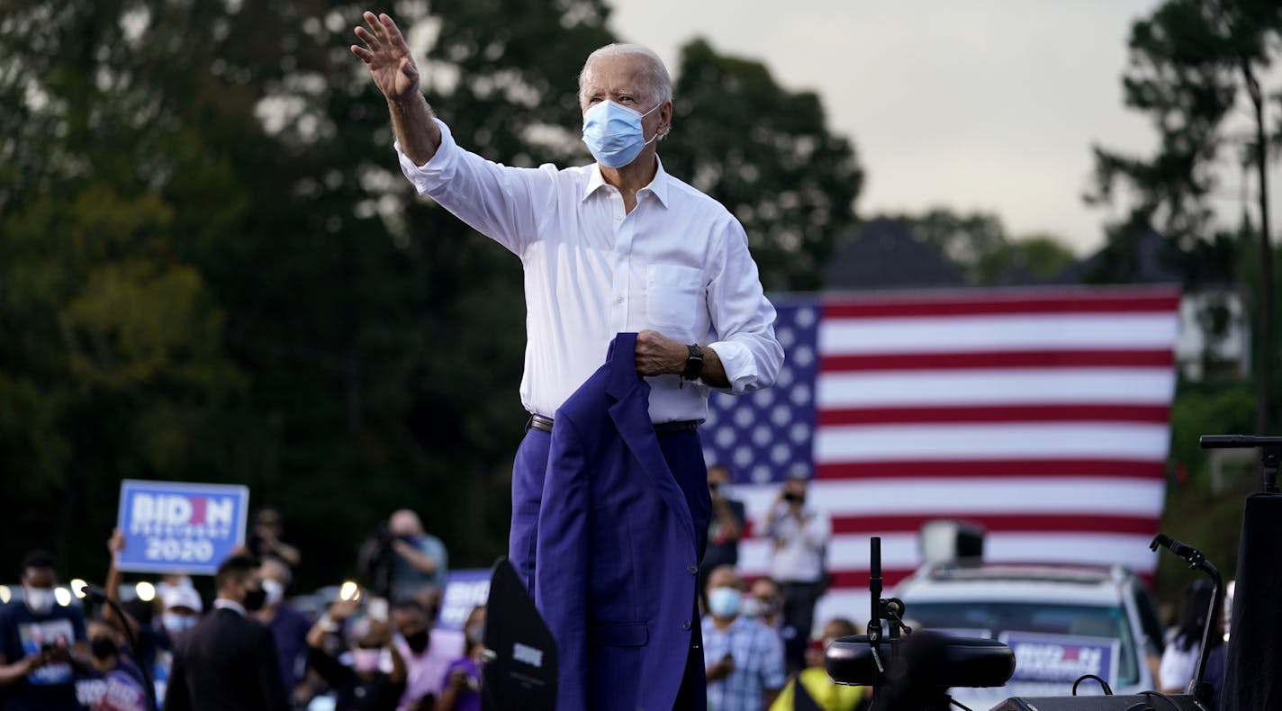 Democratic presidential candidate former Vice President Joe Biden greets supporters during a drive-in rally at Cellairis Amphitheatre in Atlanta, Tuesday, Oct. 27, 2020. (AP Photo/Andrew Harnik)