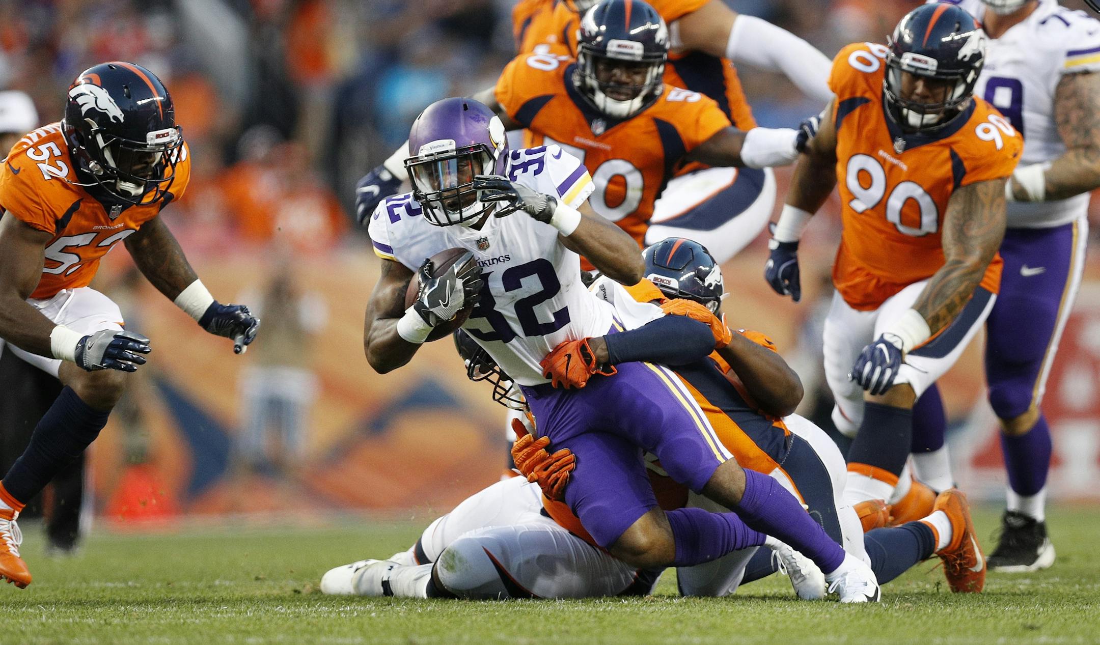 Minnesota Vikings running back Roc Thomas (32) broke a tackle picking up a first down in the second quarter Saturday August 11, 2018 at Broncos Stadium at Mile High in Denver, CO.