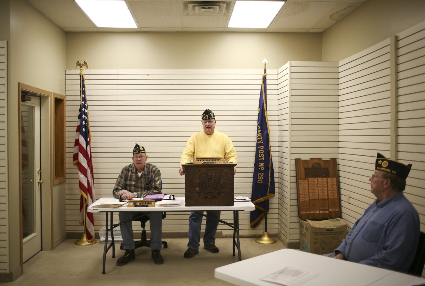 In small cities across the state, American Legion and VFW posts are selling the big buildings they put up back when World War II veterans were joining in droves. Now, outstate posts need to save on expenses in a time of falling membership. The Cambridge American Legion Post sold their building downtown earlier this year. Commander Clark Swanson presided Tuesday night, December 10, 2013, as the members of Post 290 held their first meeting in their new, rented storefront. Jim Thoreson, Adjutant, w