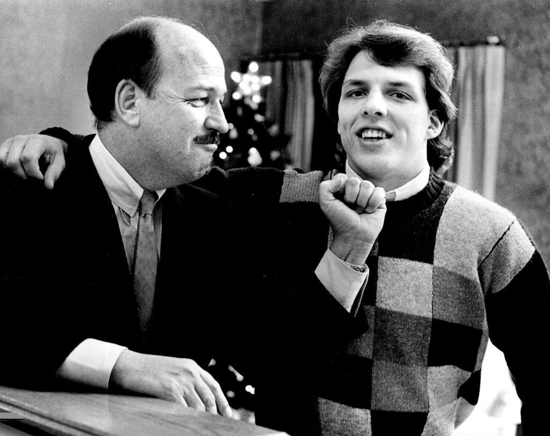 Wrestling announcer "Mean Gene" Okerlund with his son Todd, a star with the Gopher hockey team, in 1985.