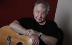 In this June 20, 2017, photo, John Prine poses in his offices in Nashville, Tenn. (AP Photo/Mark Humphrey) ORG XMIT: TNMH1