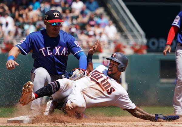 Twins Byron Buxton(25) is called safe at 3rd base on a triple as Asdrubal Cabrera applies the tag in the 2nd inning.] At Target Field, the Twins take 