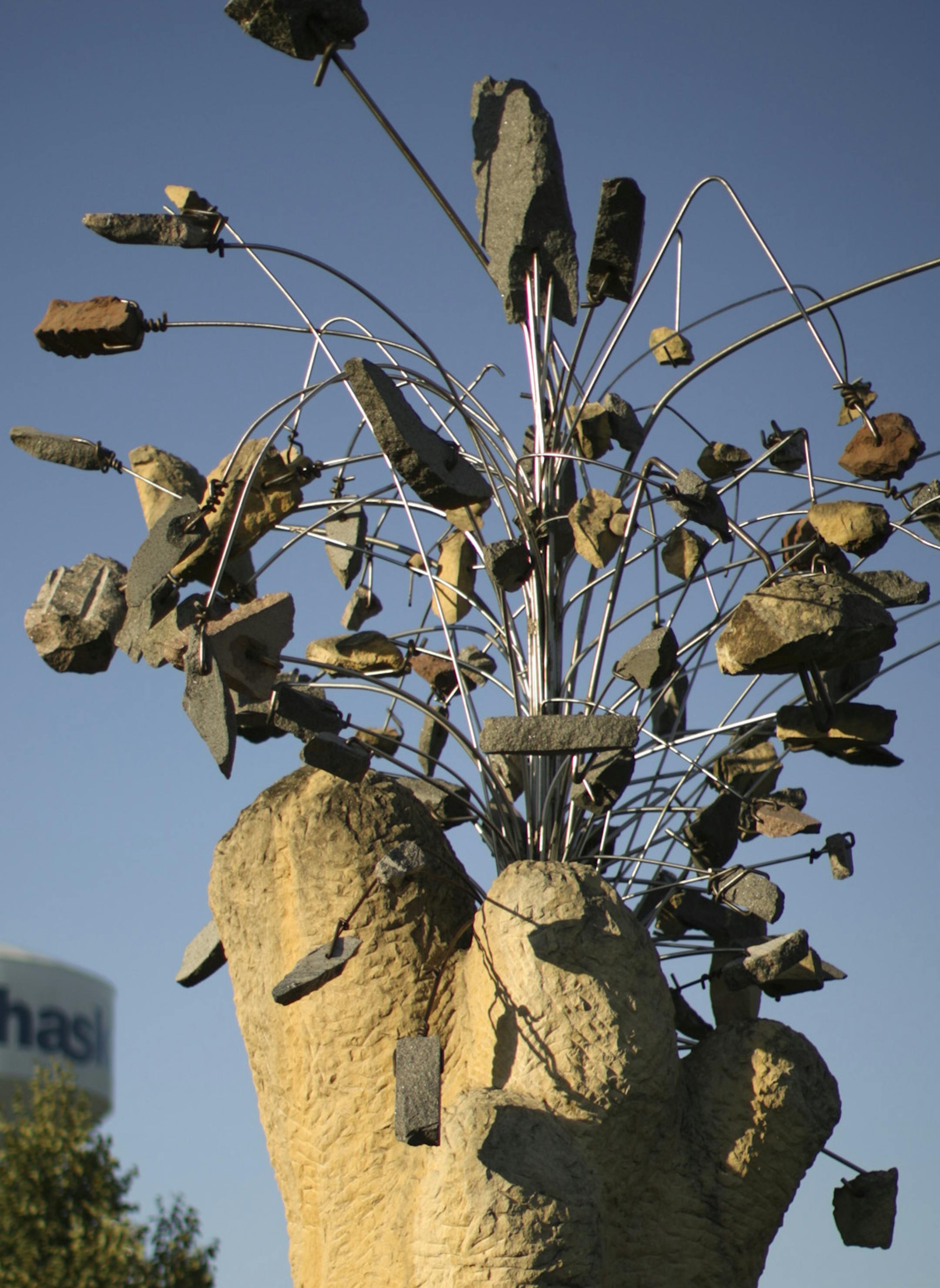 "Nature Morte" by Minneapolis artist Zoran Mojsilov in Chaska Wednesday night. ] JEFF WHEELER &#xef; jeff.wheeler@startribune.com A dozen years after it landed in Chaska, "Nature Morte" still causes a ripple. The large abstract concrete and metal sculpture cost the city $23,000 and some complain that it's out of place in a conventional suburban subdivision. the piece, installed in Chaska in 2003, was photographed Wednesday evening, July 29, 2015.