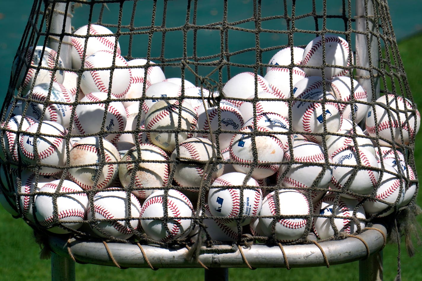 This is a basket of Major League baseballs used during warm ups before a spring training exhibition baseball game between the Pittsburgh Pirates and the Detroit Tigers at LECOM Park in Bradenton, Fla., Tuesday, March 2, 2021. (AP Photo/Gene J. Puskar