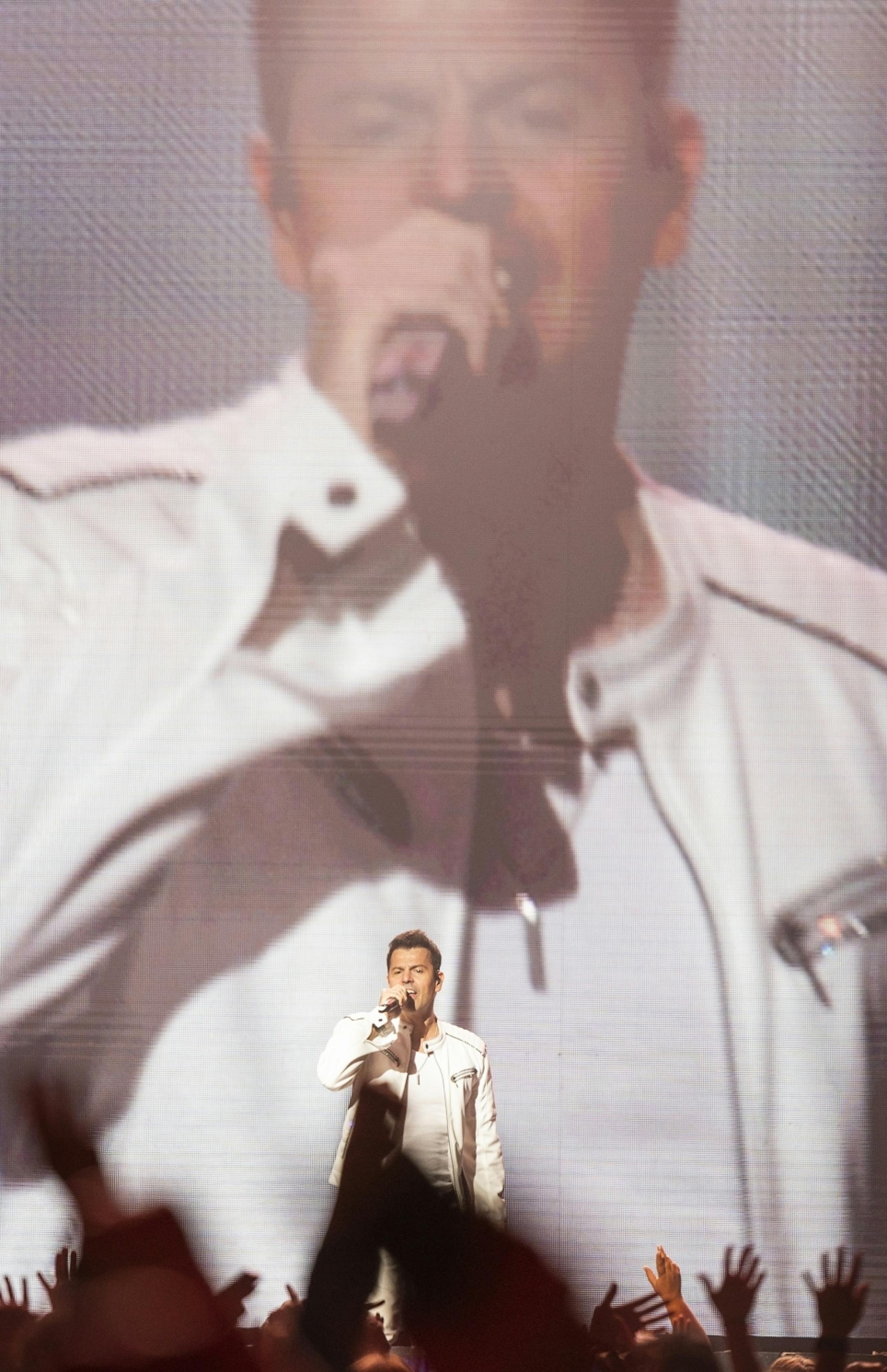 Jordan Knight sings as New Kids on the Block performs at Xcel Energy Center.