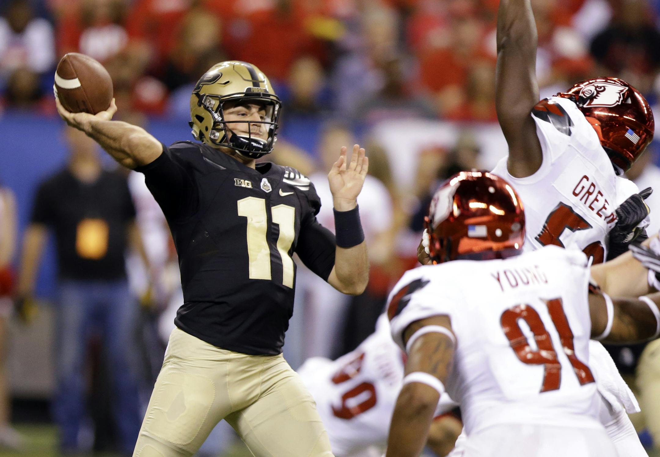 Purdue quarterback David Blough (11) throws against Louisville during the second half of an NCAA college football game in Indianapolis, Saturday, Sept. 2, 2017. (AP Photo/Michael Conroy)