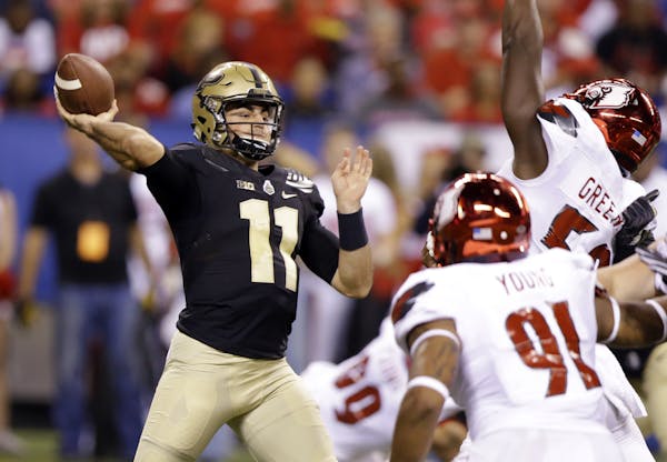 Purdue quarterback David Blough (11) throws against Louisville during the second half of an NCAA college football game in Indianapolis, Saturday, Sept