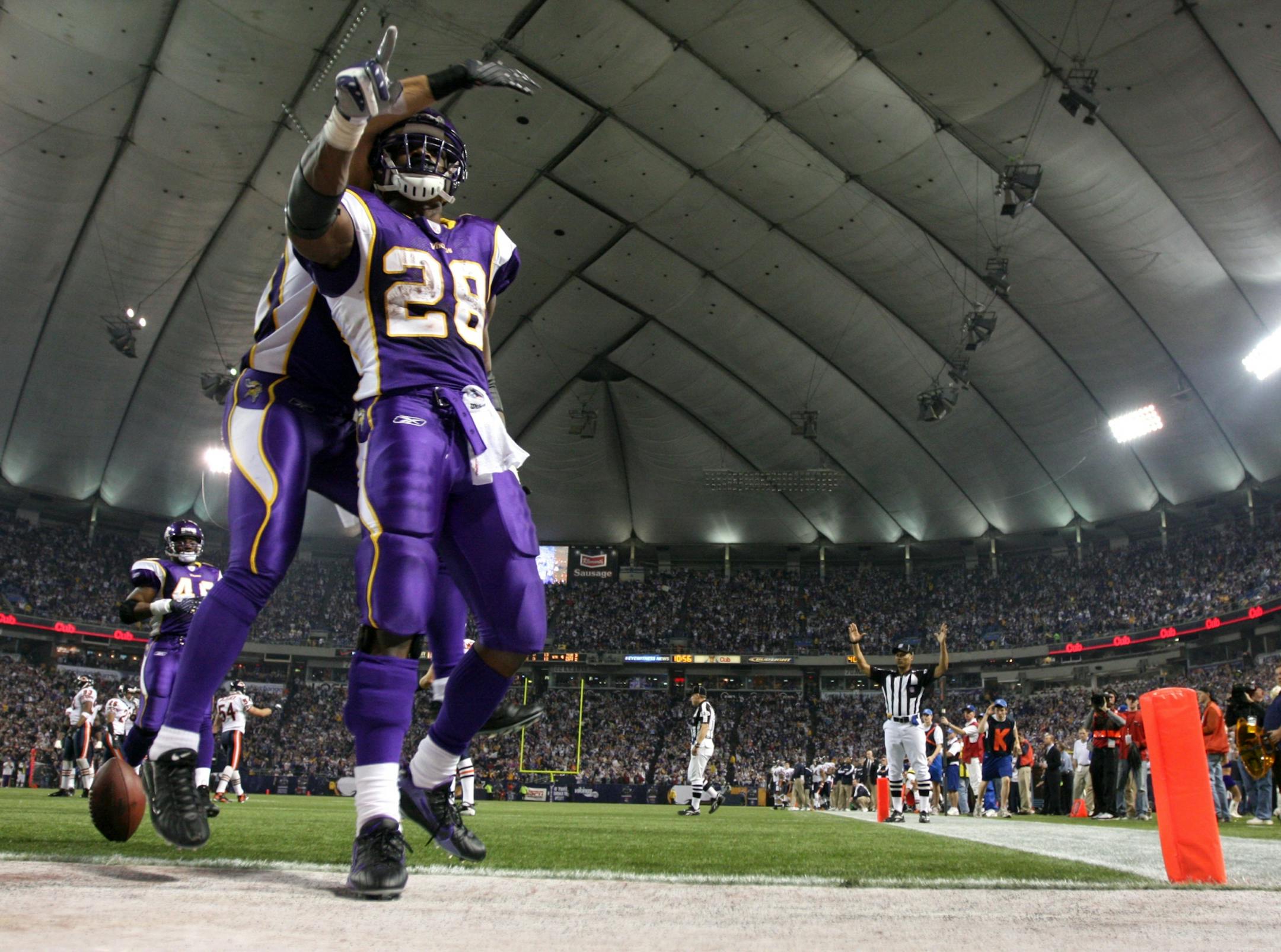 Vikings running back Adrian Peterson (28) celebrated after scoring a touchdown in a 2012 game against the Bears.