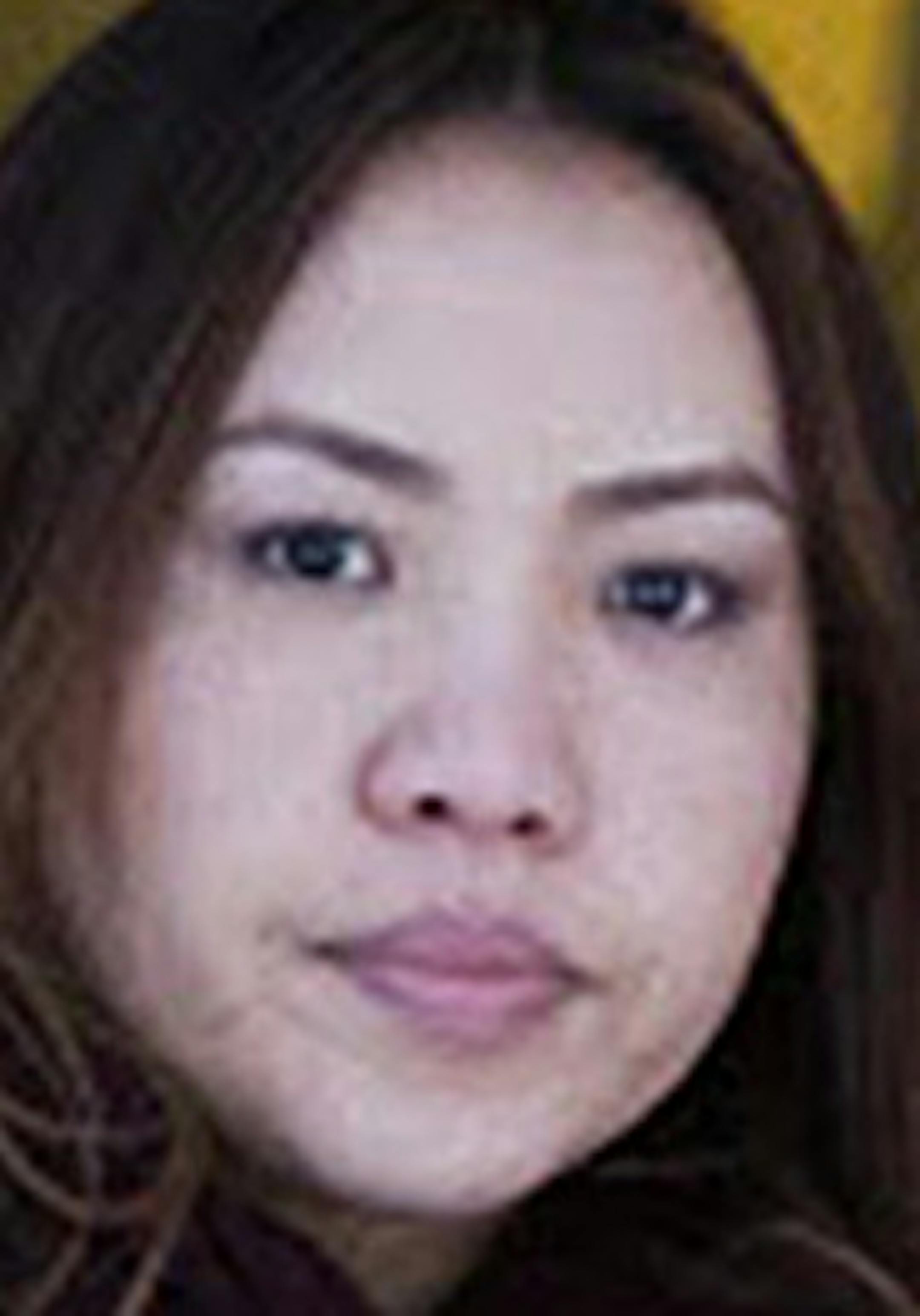 Koua Fong Lee, left, his wife Panghoua Moua and their attorney Bob Hilliard pause outside of the Federal Courthouse in Minneapolis on Thursday, January 8, 2015. ] LEILA NAVIDI leila.navidi@startribune.com / BACKGROUND INFORMATION: A lawsuit against Toyota Corp. got underway in U.S. District Court in Minneapolis, with jurors asked to assess blame for a two-car accident that cost three people their lives and Koua Fong Lee's imprisonment for more than two years. ORG XMIT: MIN1501081739260937